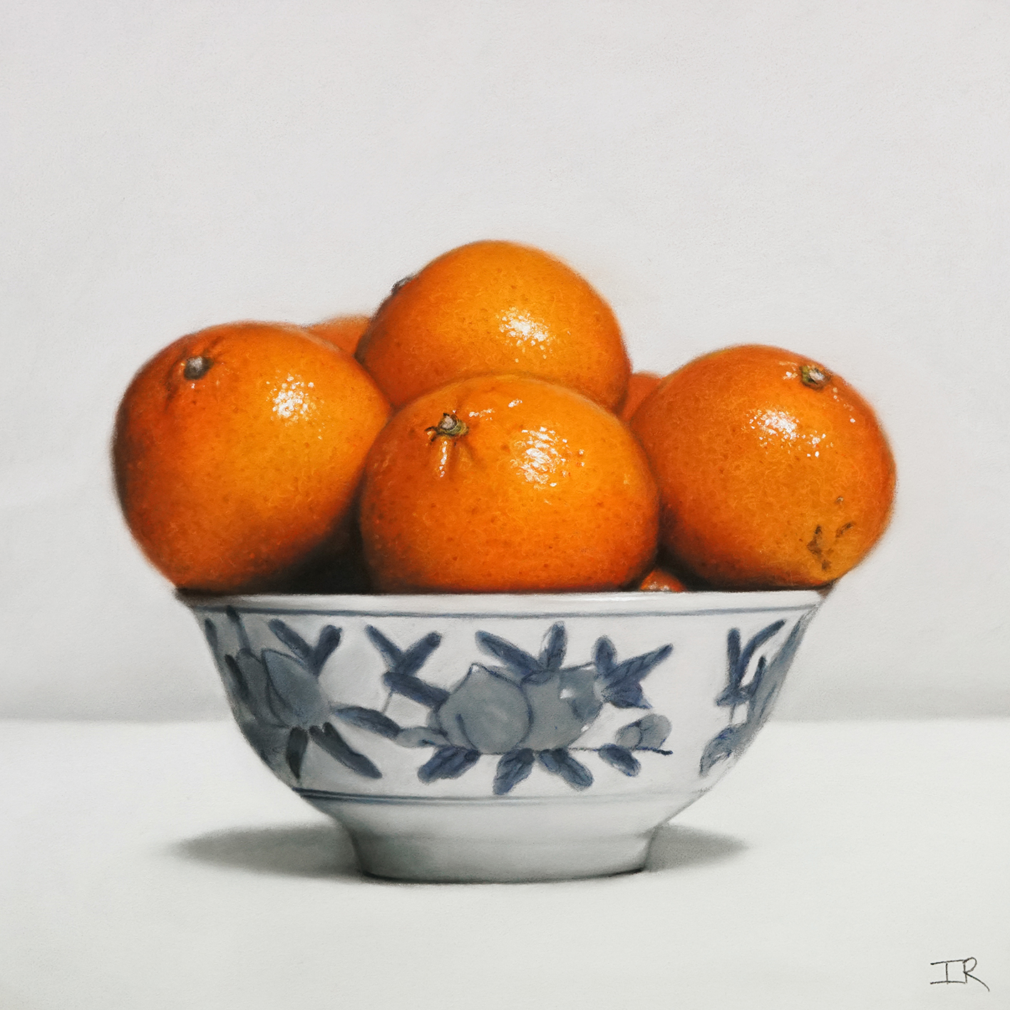 Oranges In White Flowery Bowl